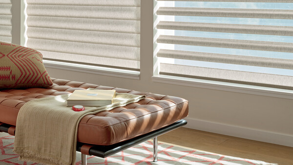 blinds in living room with leather chaise lounge